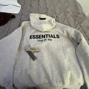 light gray men’s essentials hoodie XS but fits like a S/M